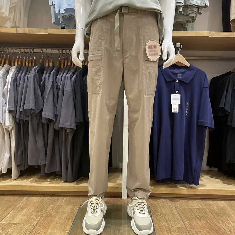 Men's straight leg work trousers in bamboo fibre fabric with micro elasticity stretch available in black, olive, and beige colours.