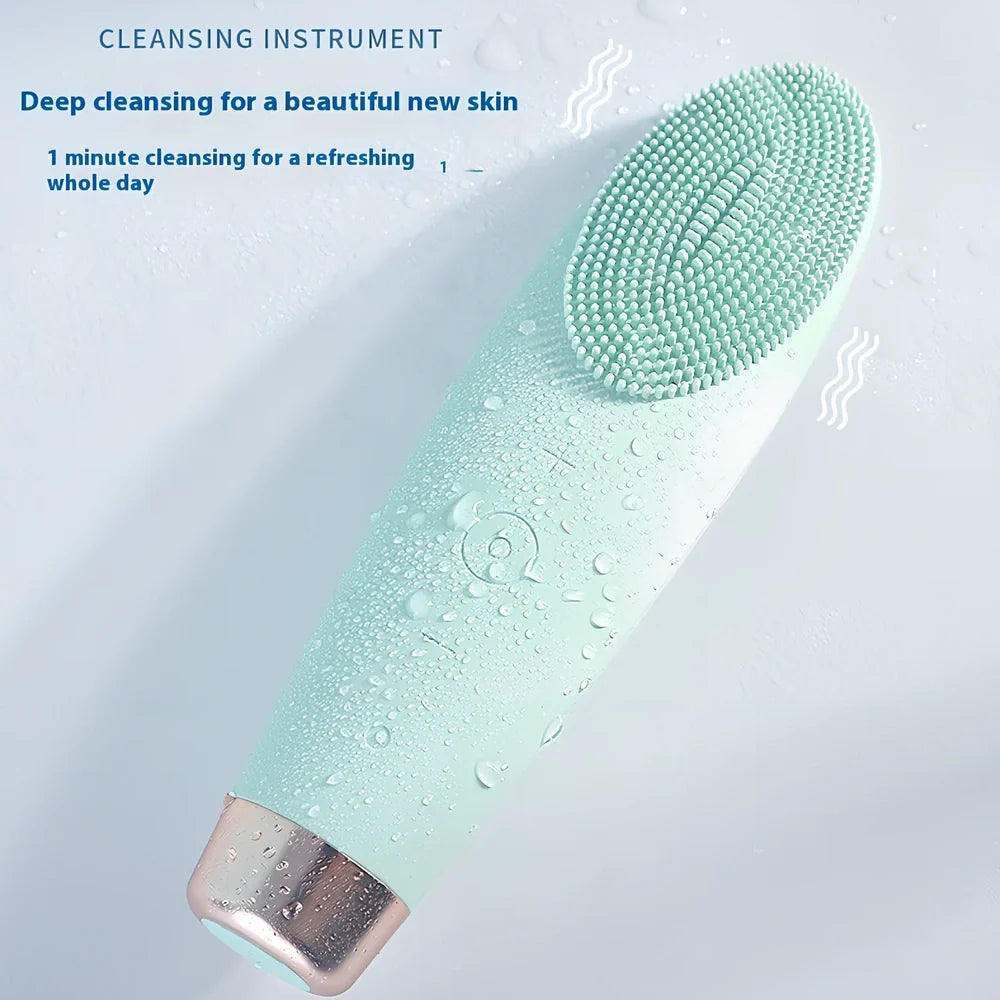 Green electric facial cleaner with silicone brush head, measuring 15cm length