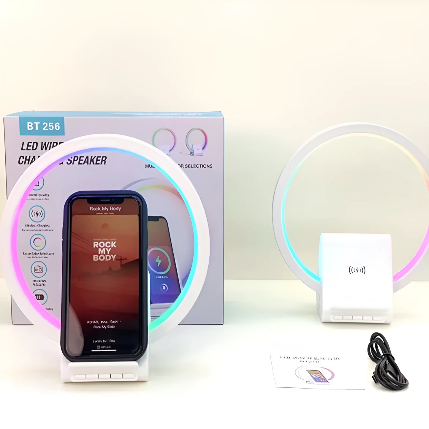 White smart Bluetooth speaker with ambience light and wireless charging pad