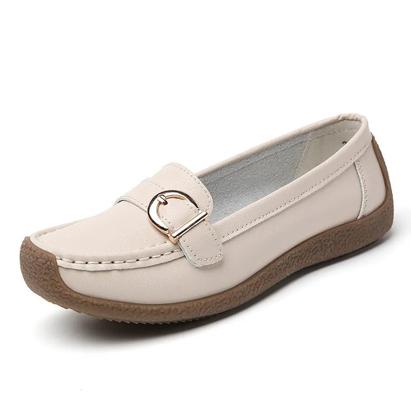 Women's beige casual loafers with a round toe and shallow-cut vamp on a beef tendon sole.