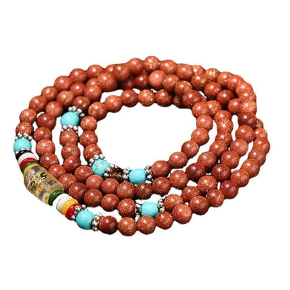Women's golden star stone colour bracelet with 108 nugget sand pieces showing mantra text and fu character design