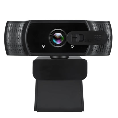 Black USB webcam with microphone on a laptop screen, showing 360-degree rotation and universal clip.