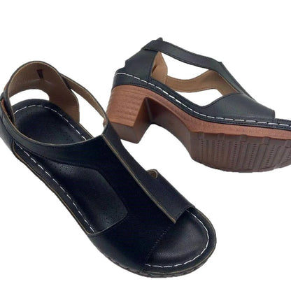 Women's beige peep toe wedge sandals with a buckle strap and low heel on a white background.