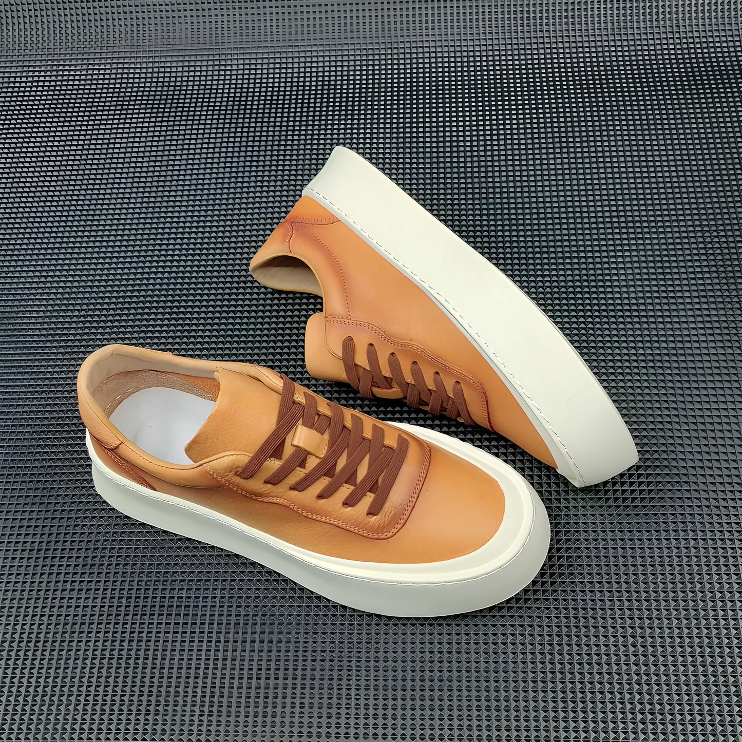 Men's white genuine cowhide board shoes with a thick rubber platform sole and round toe.