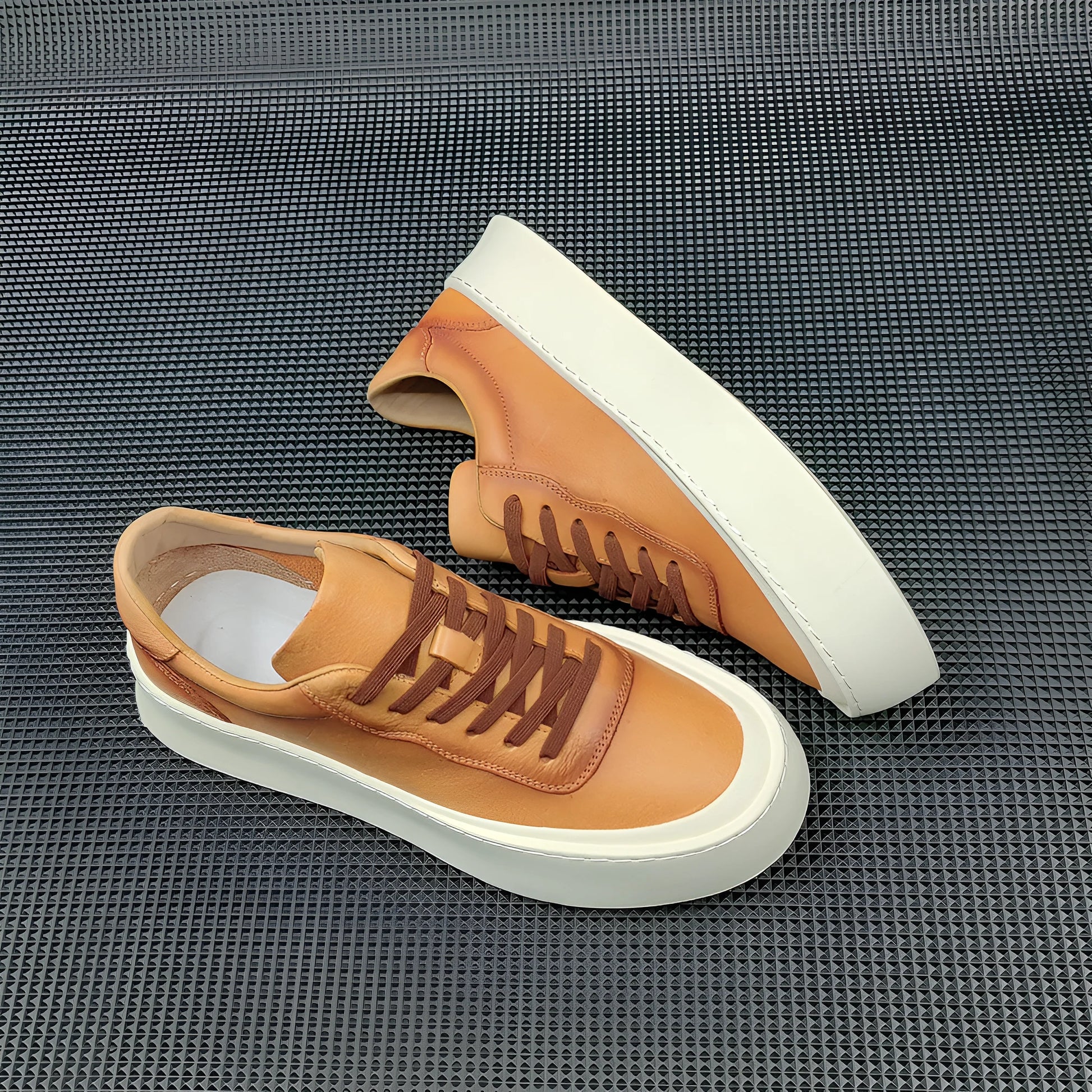Men's white genuine cowhide board shoes with a thick rubber platform sole and round toe.