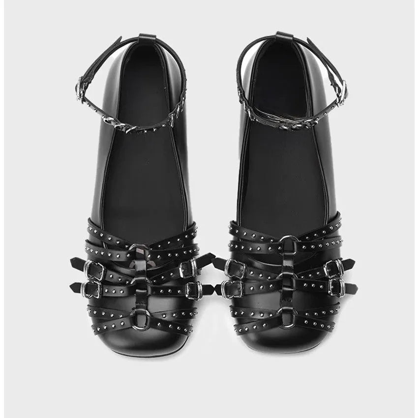 Women's black patent leather retro pumps with square toe and buckle closure on low flat heel