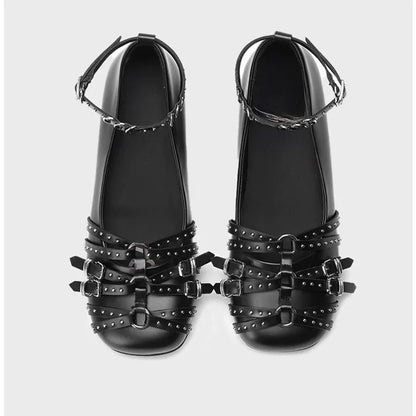 Women's black patent leather retro pumps with square toe and buckle closure on low flat heel