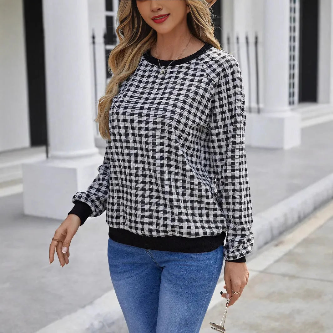 Black plaid pullover sweater with striped pattern and long sleeves, showing printing detail on polyester fabric