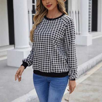 Black plaid pullover sweater with striped pattern and long sleeves, showing printing detail on polyester fabric