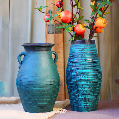 Ceramic mosaic vase with dried flower arrangement, handcrafted surface detailing