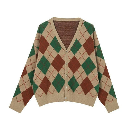 Long sleeve knitted cardigan in a light khaki colour, shown open over a white top, demonstrating its relaxed fit and medium weight.