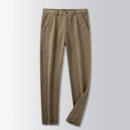 Man wearing khaki and black striped straight-leg retro trousers with a zip fly.