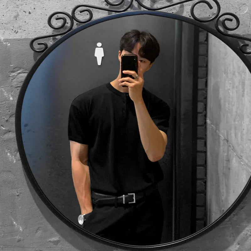 Man wearing a black slim-fit short-sleeved ice silk knit pullover shirt.