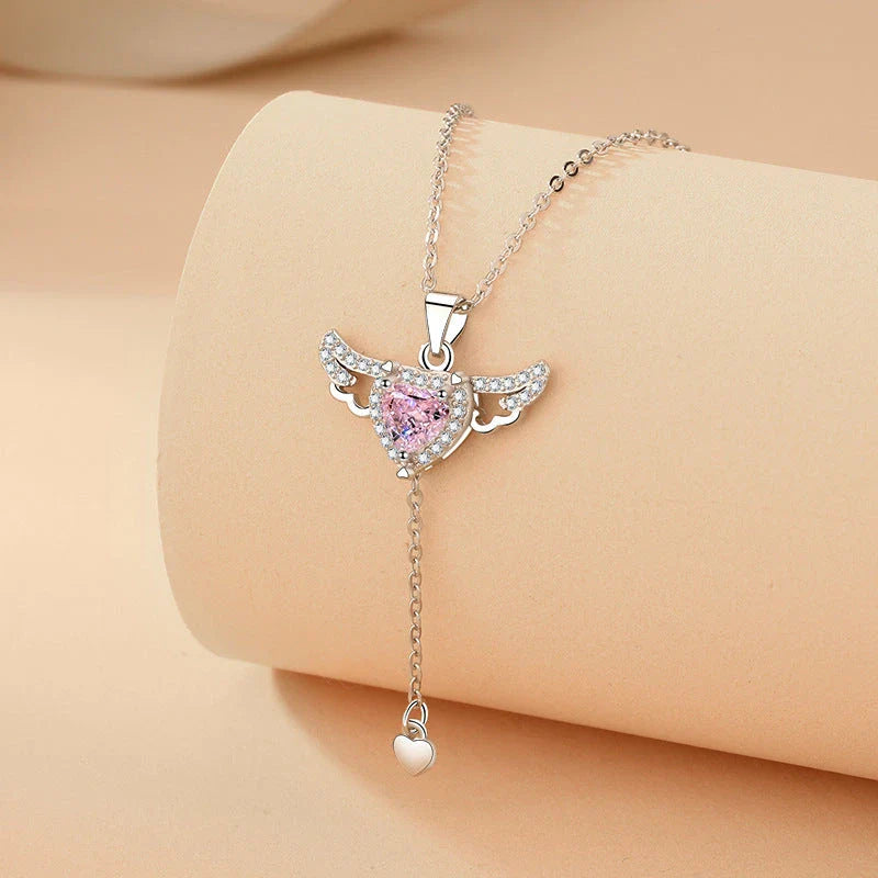 Elegant angel wings necklace with moving heart pendant, made of titanium steel and crystal accents