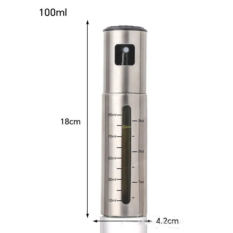 Glass oil spray bottle with stainless steel press cap showing 100ml capacity