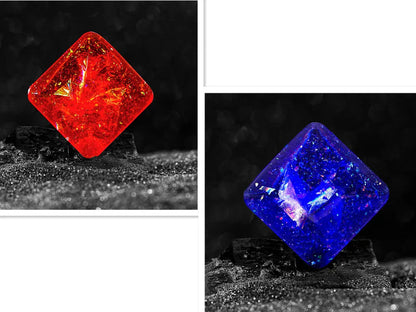 Galactic edition pocket gyro desk toy on a surface, showing its quadrilateral resin construction and celestial colour design.