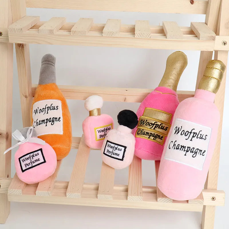Soft green plush wine bottle pet toy for cats and dogs on a white background.