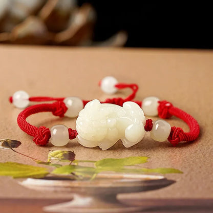 Hetian jade bracelet with black and red adjustable ropes in traditional Chinese design