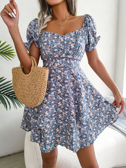 Stylish floral mini dress with ruffled skirt, high-waist design, and short sleeves for a flattering and comfortable summer look