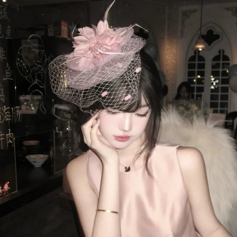 French retro feather headdress hair flower with mesh base and feather detailing in pink colour