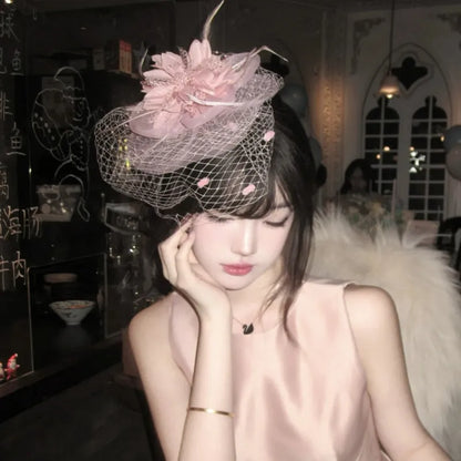 French retro feather headdress hair flower with mesh base and feather detailing in pink colour