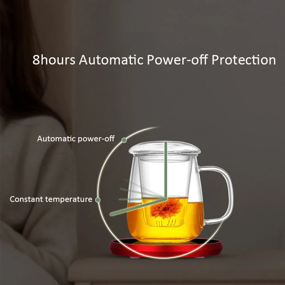 Black USB heating coaster with a mug on its tempered glass surface, showing a red LED indicator light.
