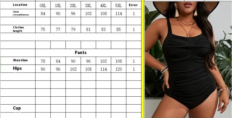 Black plus size one-piece swimsuit for women on a hanger.
