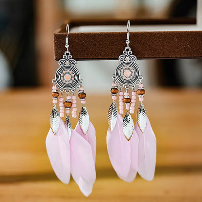 Round drop feather earrings in a bohemian leaf shape with patterned detail, shown in a light pink electroplated colour.