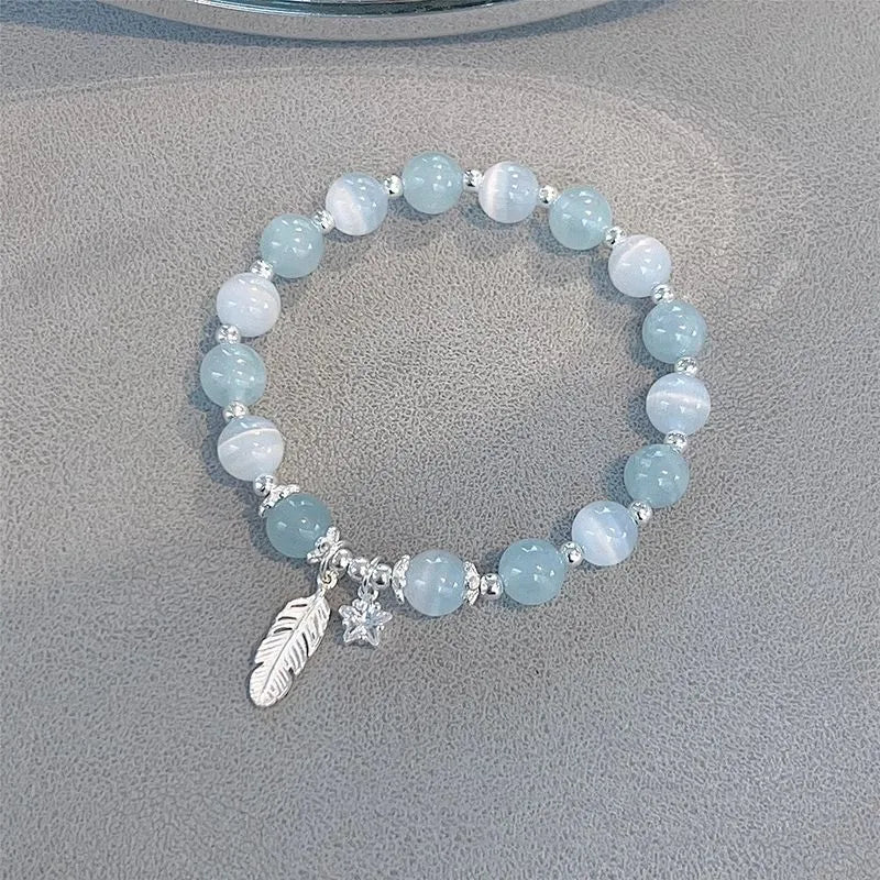 Small white girl crystal bracelet with blue moonlight feather charm and Korean style design