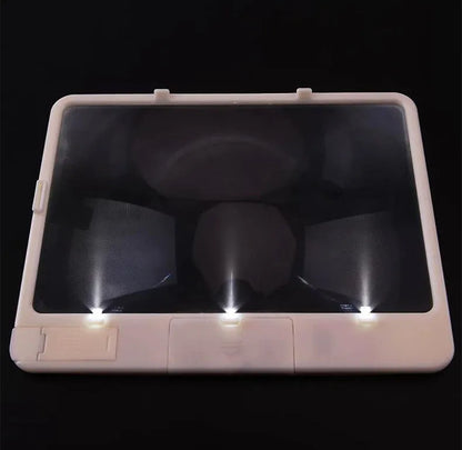 Black desktop LED magnifying glass with 3x magnification and a large 180x140mm PVC lens lit by three white LEDs.