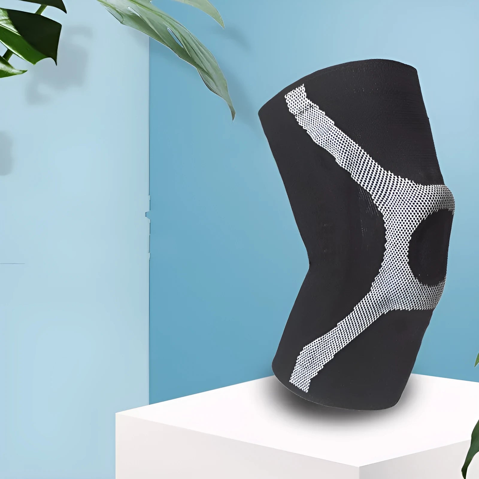 Knitted sports knee pads with silicone grip in red and grey colours for running climbing protection