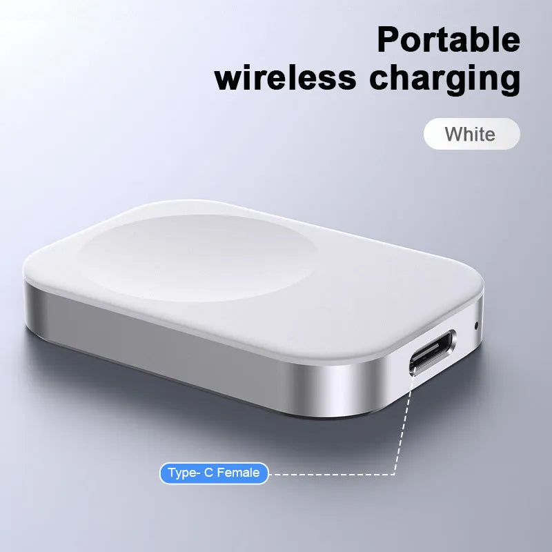 Compact black and white 3-in-1 magnetic wireless charger with integrated cables, shown next to a smartphone for scale.
