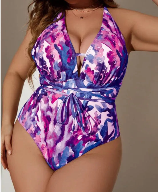 Purple halter neck one-piece swimsuit for women on a mannequin, showing brief style and back detail.