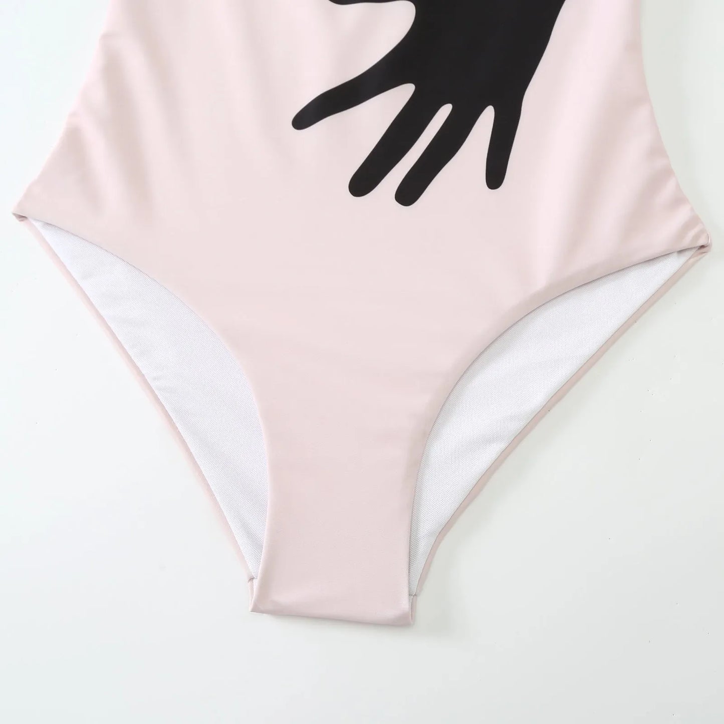 Women's one-piece bikini swimsuit with a white tulle skirt overlay on a mannequin.
