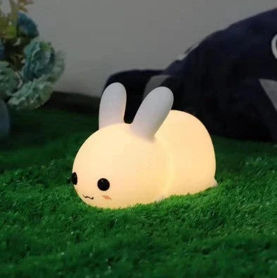 Rabbit-shaped silicone nightlight with warm amber and cool white dual colour illumination, perfect for bedside or home decor