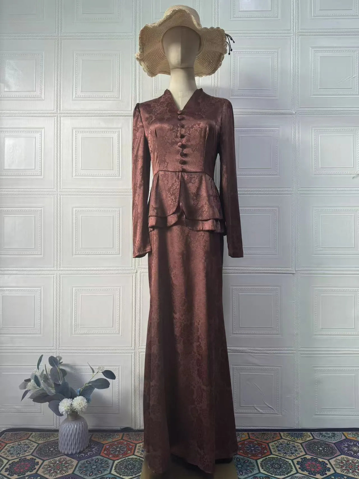 Dark brown long sleeve dress with plant and flower pattern, faux two-piece retro style.