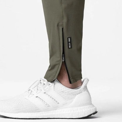 Men's grey fitness trousers with ankle ties, made from 100% polyester for quick-drying during exercise