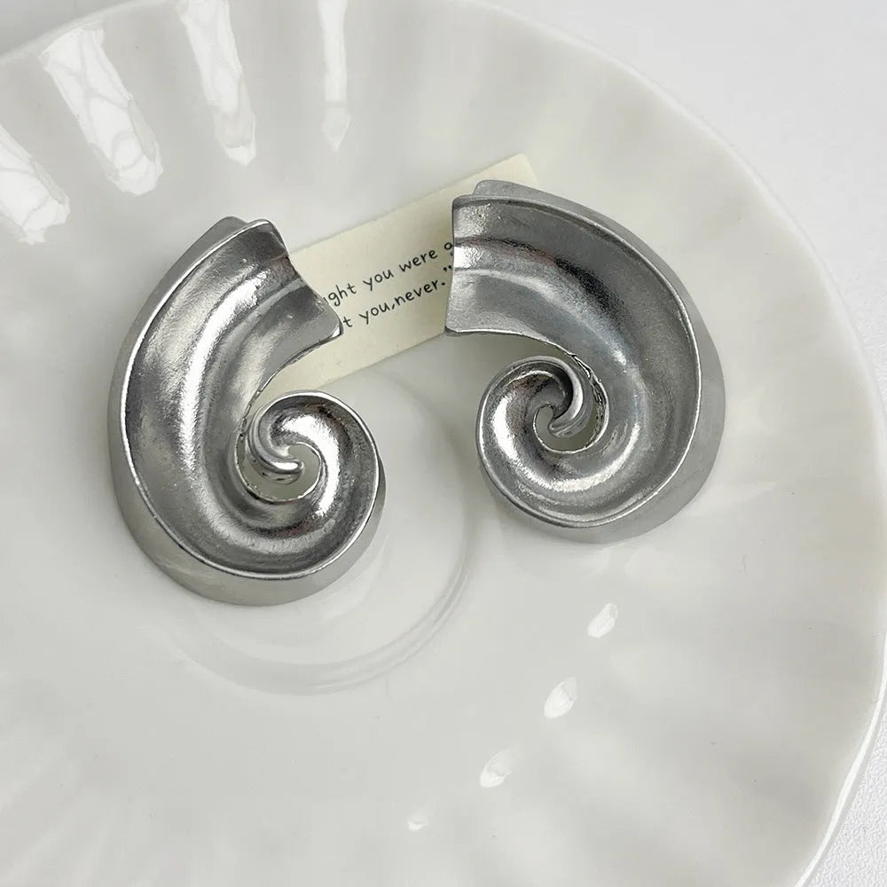 Gold and silver retro geometric alloy ear studs on a white background.