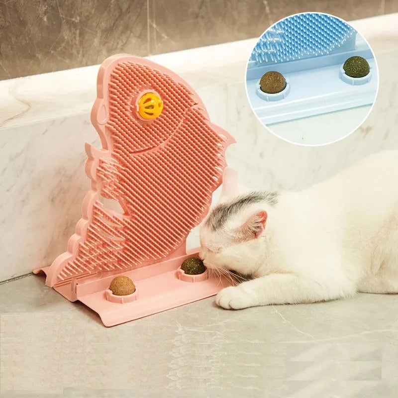 Blue plastic fish-shaped cat wall scratcher with grooming brush, catnip balls, and bell