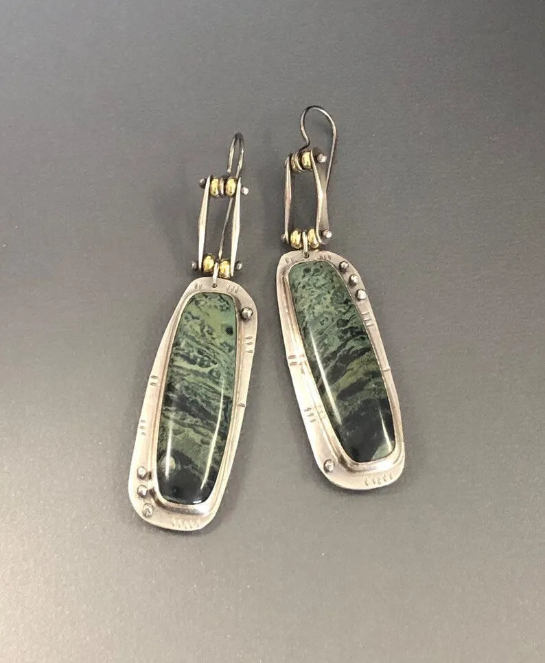 Two-tone geometric marble pattern alloy earrings with butterfly clasp, showing front and side views