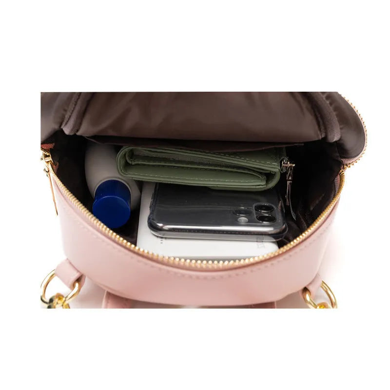 Soft PU mini backpack with three-dimensional pocket showing internal mobile phone bag organisation