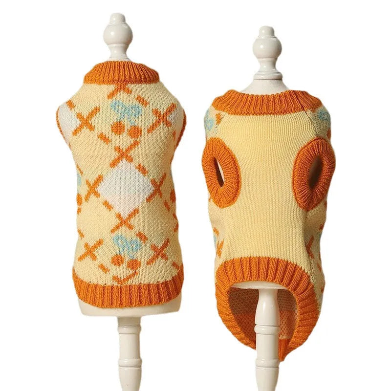Orange cherry diamond pattern cat sweater shown on feline model with size label