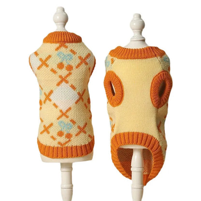 Orange cherry diamond pattern cat sweater shown on feline model with size label
