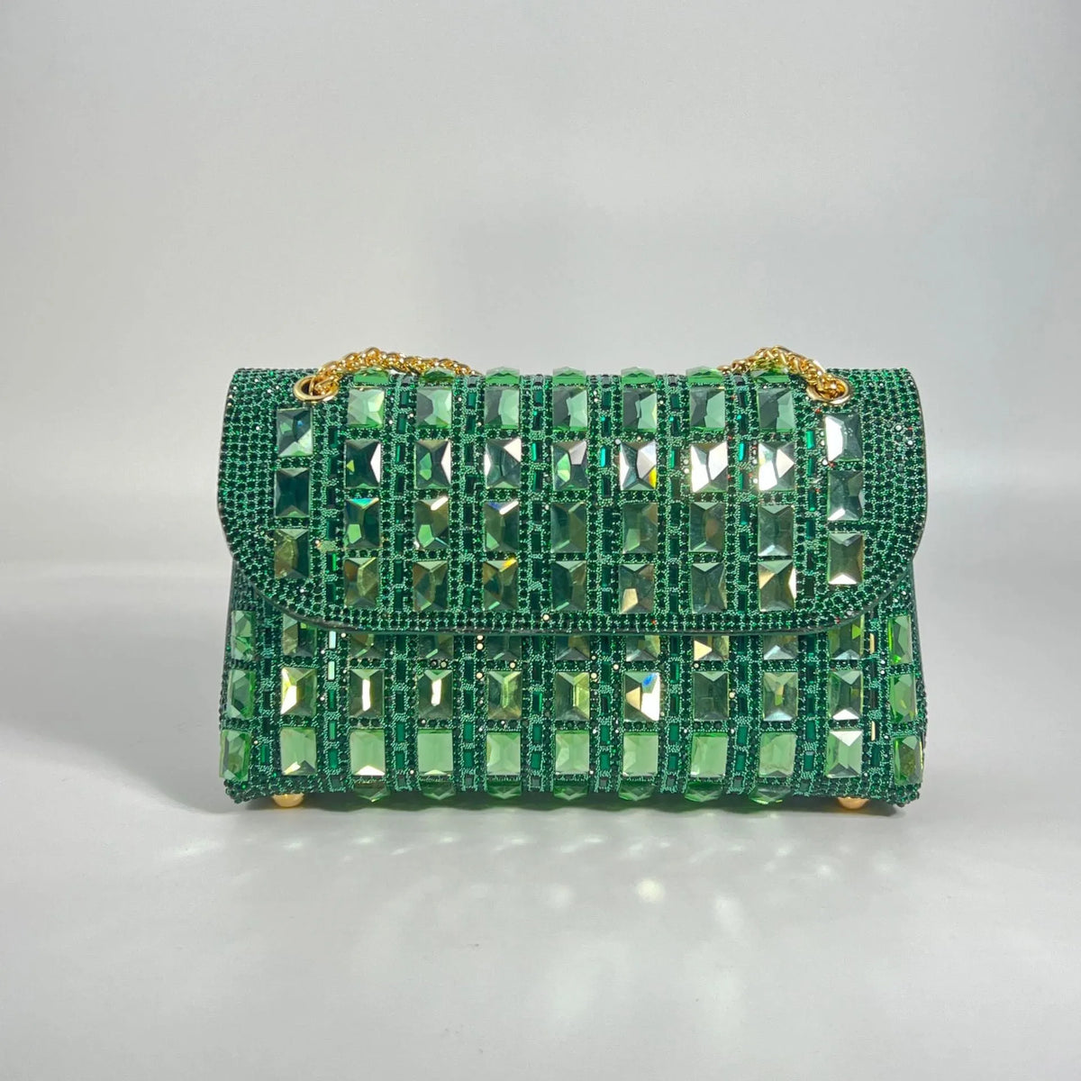 Silver rhinestone-decorated PU leather clutch bag with a metal chain strap, shown open to reveal interior phone pocket.