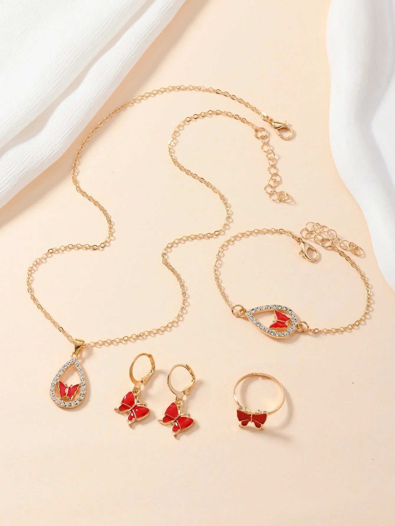 Women's 4PCS Butterfly Jewelry Set with diamond accents in red, pink, white, and black