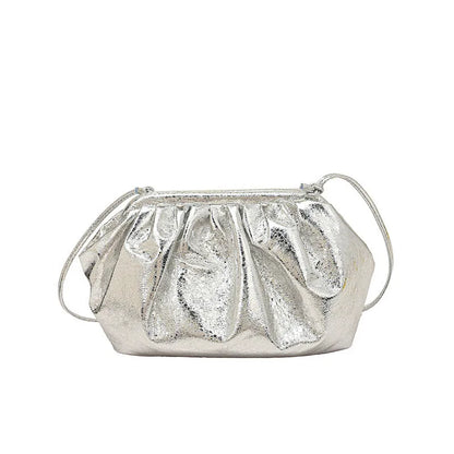 Simple hair clip shoulder crossbody bag in shell shape with visible sewing lines, shown in rose red colour.