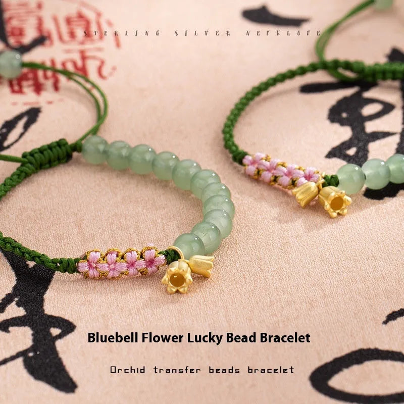 Red rope hand woven bracelet with floral design and Lily carrying strap colour