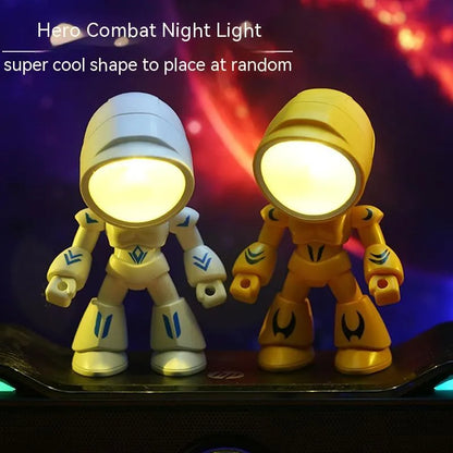 Mini mecha robot hero LED night light with adjustable arms on a desk.