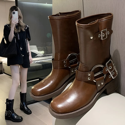 Women's black platform ankle boots with a silver buckle on the shaft, shown in a middle-calf length style.