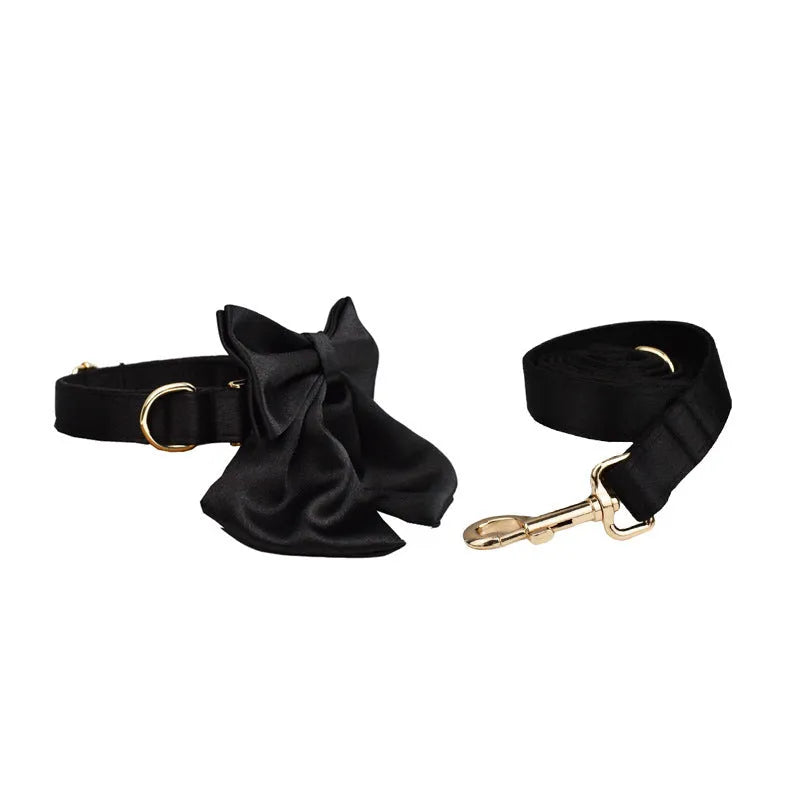 Cloth dog collar and leash set with chest strap harness, adjustable vest, and decorative bow.